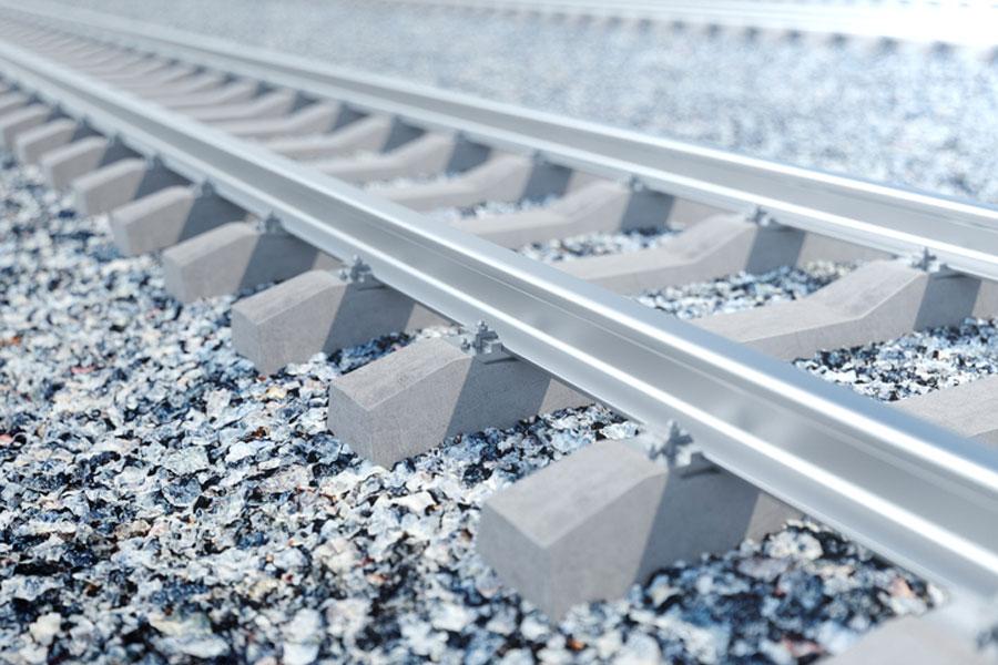 Geogrid reinforced rail tracks – Part 1: Large scale test results and full scale field trails